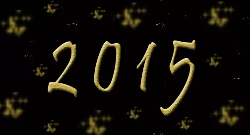 The image shows the numbers "2015" in gold, with a black background and small gold sparkles.