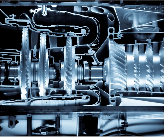 An X-ray view of mechanical gears and components inside a machine showcases intricate details, reflecting the precision crucial in turbomachinery development. The detailed structures reveal the engineering expertise essential for effective commercialization services.