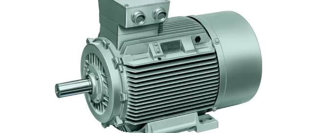 A large industrial electric motor with ribbed housing and a power connection box on top, ideal for integration into turbomachinery projects by Softinway.