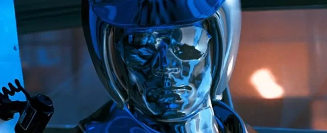 A metallic humanoid figure with a reflective surface stands in a dimly lit environment.