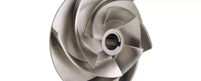 A gray metallic impeller with multiple curved blades radiating from a central hub.