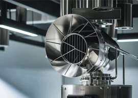 Close-up of industrial ventilation equipment with metal ducts and a fan, resembling a high-tech appliance, set in a modern interior with overhead lighting.